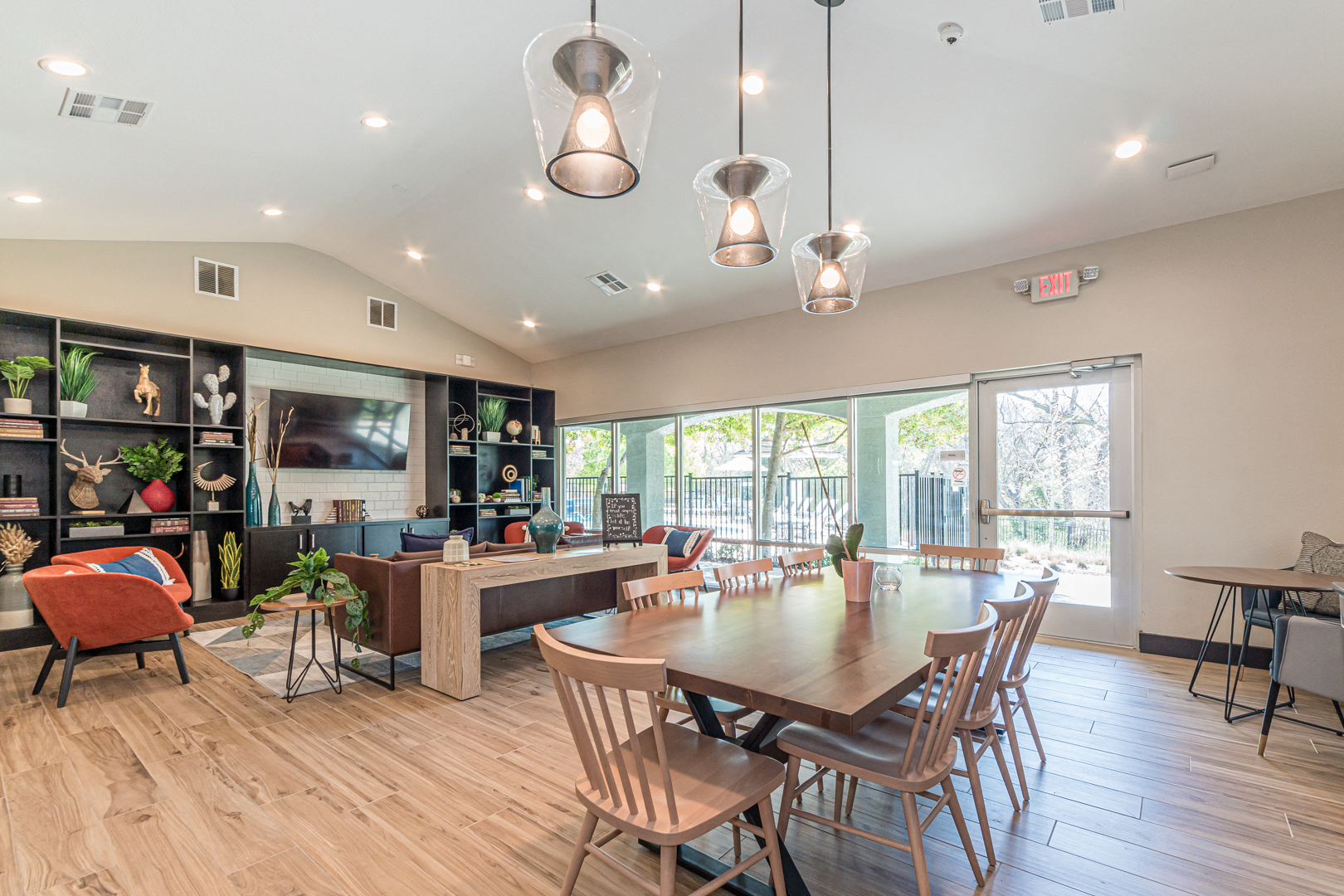 the preserve at ballantyne commons clubhouse with dining table and living room